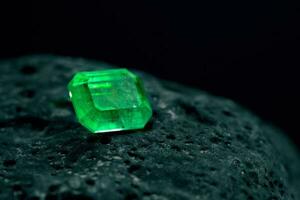 Luxury Emerald Gemstone on Natural Stone photo