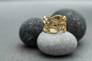 Luxury Gold Ring on Natural Stone photo