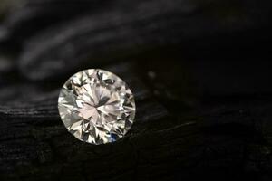 Diamond Gemstone on Black Coal photo