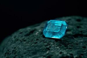 Blue Sapphire Gemstone on Natural Stone photo