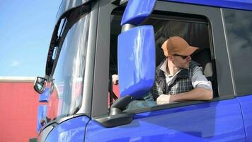 Truck Driver in His 30s in the Modern Euro Semi Truck Taking Short Brake video