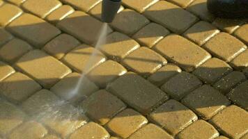 Cobble Brick Driveway Pressure Washing by Worker. video