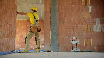 Caucasian Construction Contractor Inside Concrete Blocks Built Building video