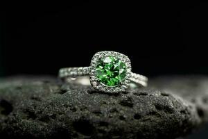 Emerald Ring on Black Natural Stone photo