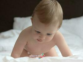 Baby Crawling on The Bed photo