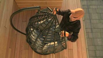 Man Assembling Hanging Chair In Backyard. video