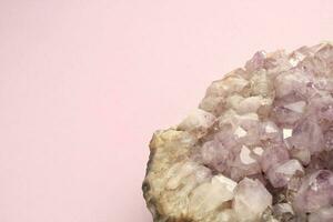 Natural violet amethyst druse geode mineral crystal polished semi-precious gemstone on purple background. Magic rock for witchcraft, spiritual practice, meditation. Esoteric life balance concept photo
