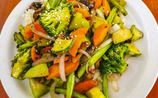 Fried rice and vegetables on white plate Puerto Escondido Mexico. photo