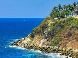 Beach sand blue turquoise water waves panorama Carrizalillo Puerto Escondido. photo