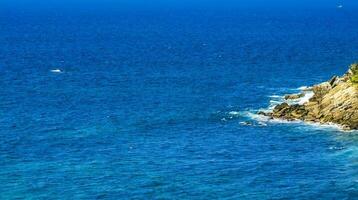 Beach sand blue turquoise water waves panorama Carrizalillo Puerto Escondido. photo