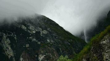 Scenic Waterfall and the Cloudy Rainy Day in Norway. 4K Timelapse Video