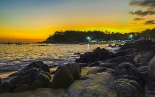 Colorful golden sunset big wave and beach Puerto Escondido Mexico. photo