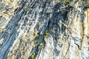 Rock cliff wall texture limestone islands Koh Phi Phi Thailand. photo