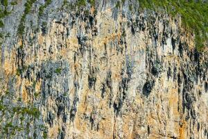 Rock cliff wall texture limestone islands Koh Phi Phi Thailand. photo