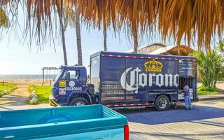 Puerto Escondido Oaxaca Mexico 2023 Mexican Corona beer trucks cargo transporter delivery cars in Mexico. photo