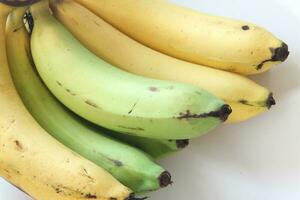 1 combed banana on a white background. photo