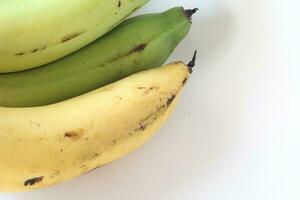 1 combed banana on a white background. photo