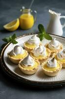 Lemon meringue tarts, one bite desserts idea, generate ai photo