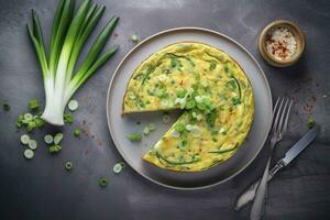 Traditional Italian vegetable frittata with zucchini, spring onion and cheese served as a top view on a Nordic design plate with copy space, generate ai photo