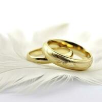 Two Golden Wedding Rings and Feather - light soft background , generat ai photo