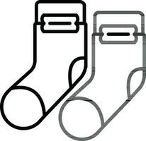 Socks icon in black line art. vector