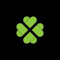 Design Illustration vector logo of a simple lucky clover green leaf isolated on a black background.