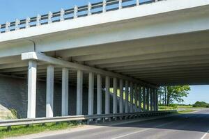 concrete columns like pillars of an automobile bridge photo