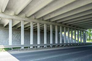 concrete columns like pillars of an automobile bridge photo