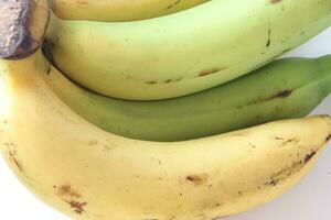 1 combed banana on a white background. photo