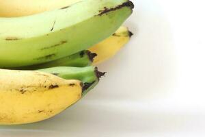 1 combed banana on a white background. photo