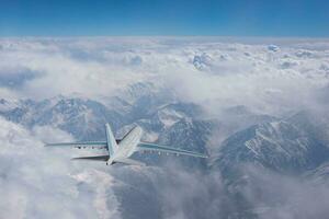 Air plane in the sky over montain photo