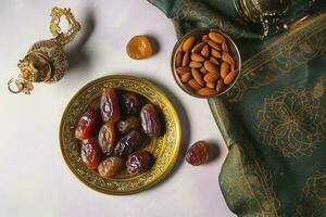 Eid al-Fitr holiday concept with sweet dried dates, fruits and decorations on bright background. Top view from above, generate ai photo