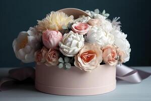 Flowers in round luxury present box. Bouquet of peonies and roses in paper box. Mock-up of hat box of flowers. Interior decoration in in pastel colors. image photo