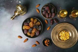 Eid al-Fitr holiday concept with sweet dried dates, fruits and decorations on bright background. Top view from above, generate ai photo