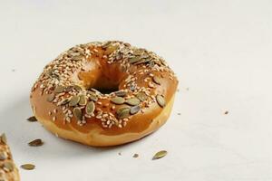 Tasty bagel with sesame and pumpkin seeds on light background, generate ai photo