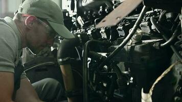 Repairman Fixing Engine Problem Under Bus Hood. video