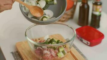 Step-by-step procedures to marinate pork for easy Korean cooking, add chopped onions and Japanese bunching onion, sesame oil, soy sauce, Korean gochujang and mix well. Korean homemade food for lunch video