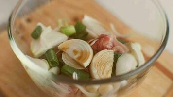 Step-by-step procedures to marinate pork for easy Korean cooking, add chopped onions and Japanese bunching onion, sesame oil, soy sauce, Korean gochujang and mix well. Korean homemade food for lunch video