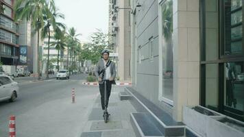 businessman riding with electric scooter to work video