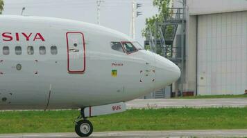 KAZAN, RUSSIAN FEDERATION SEPTEMBER 14, 2020 - Passenger Boeing 737 of Rossiya airline taxing at Kazan airport, Tatarstan. Jet plane arriving video