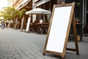 Blank restaurant shop sign or menu boards near the entrance to restaurant. Cafe menu on the street. Blackboard sign in front of a restaurant. Signboard, freestanding A-frame blackboard. . photo