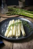 Modern style traditionally steamed white asparagus with butter sauce and cress served close-up on a Nordic design plate, generate ai photo