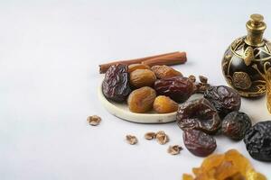 Eid al-Fitr holiday concept with sweet dried dates, fruits and decorations on bright background. Top view from above, generate ai photo
