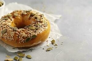 Tasty bagel with sesame and pumpkin seeds on light background, generate ai photo
