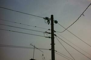 Cables and high voltage poles. evening photo. photo