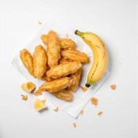 Fried bananas, Indonesian traditional food, topped with crunchy flour. photo