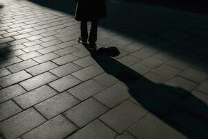 Dark shadow of a lonely person on the ground in the street. Stranger with a cigarette. Anxiety, depression, loneliness, fear concept, generate ai photo