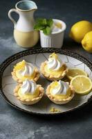 Lemon meringue tarts, one bite desserts idea, generate ai photo