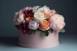 Flowers in round luxury present box. Bouquet of peonies and roses in paper box. Mock-up of hat box of flowers. Interior decoration in in pastel colors. image photo