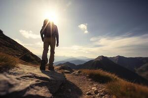 Hiker goes against sky and sun. Hiking concept created with technology photo